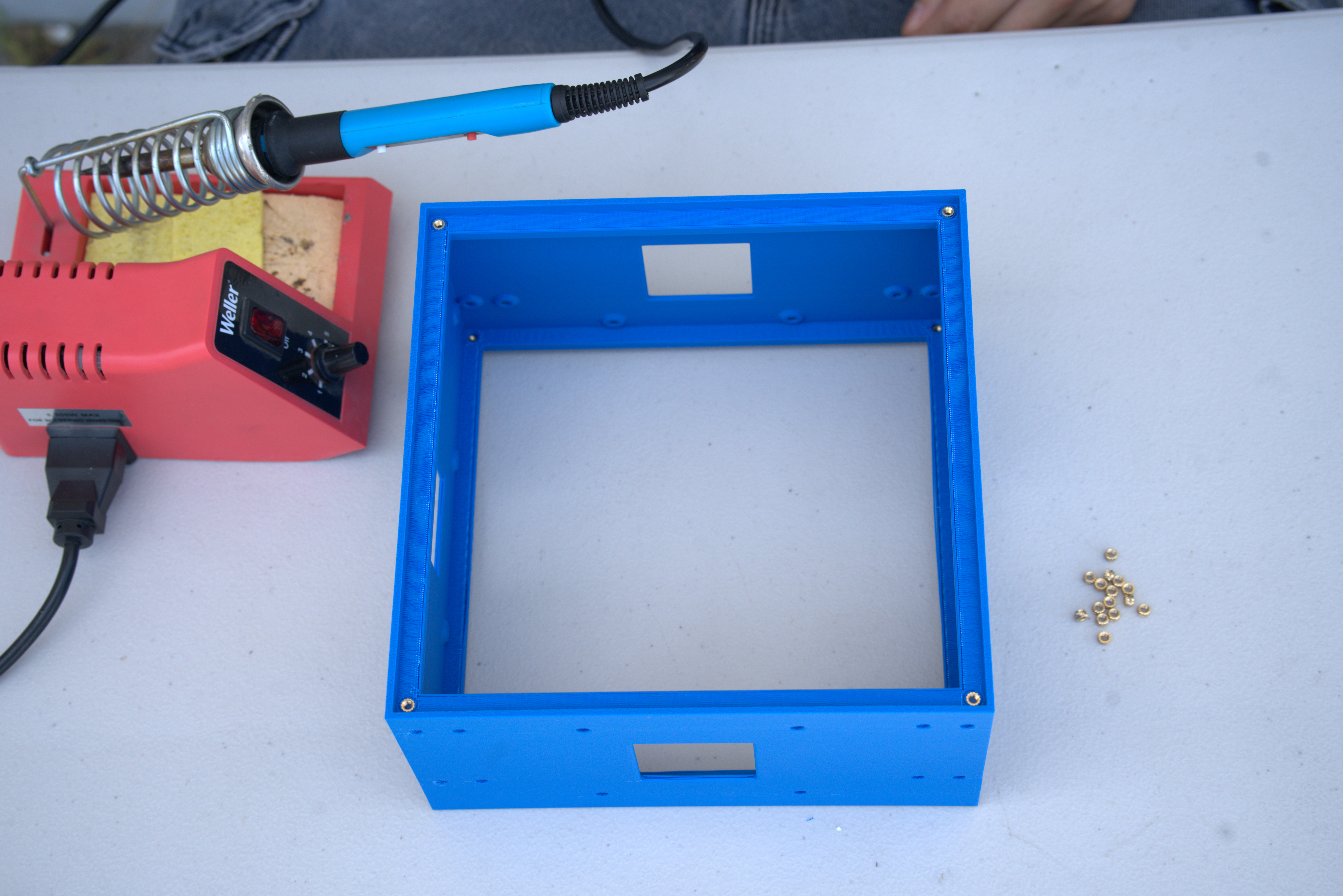 Top and bottom chassis faces with heat-set inserts installed