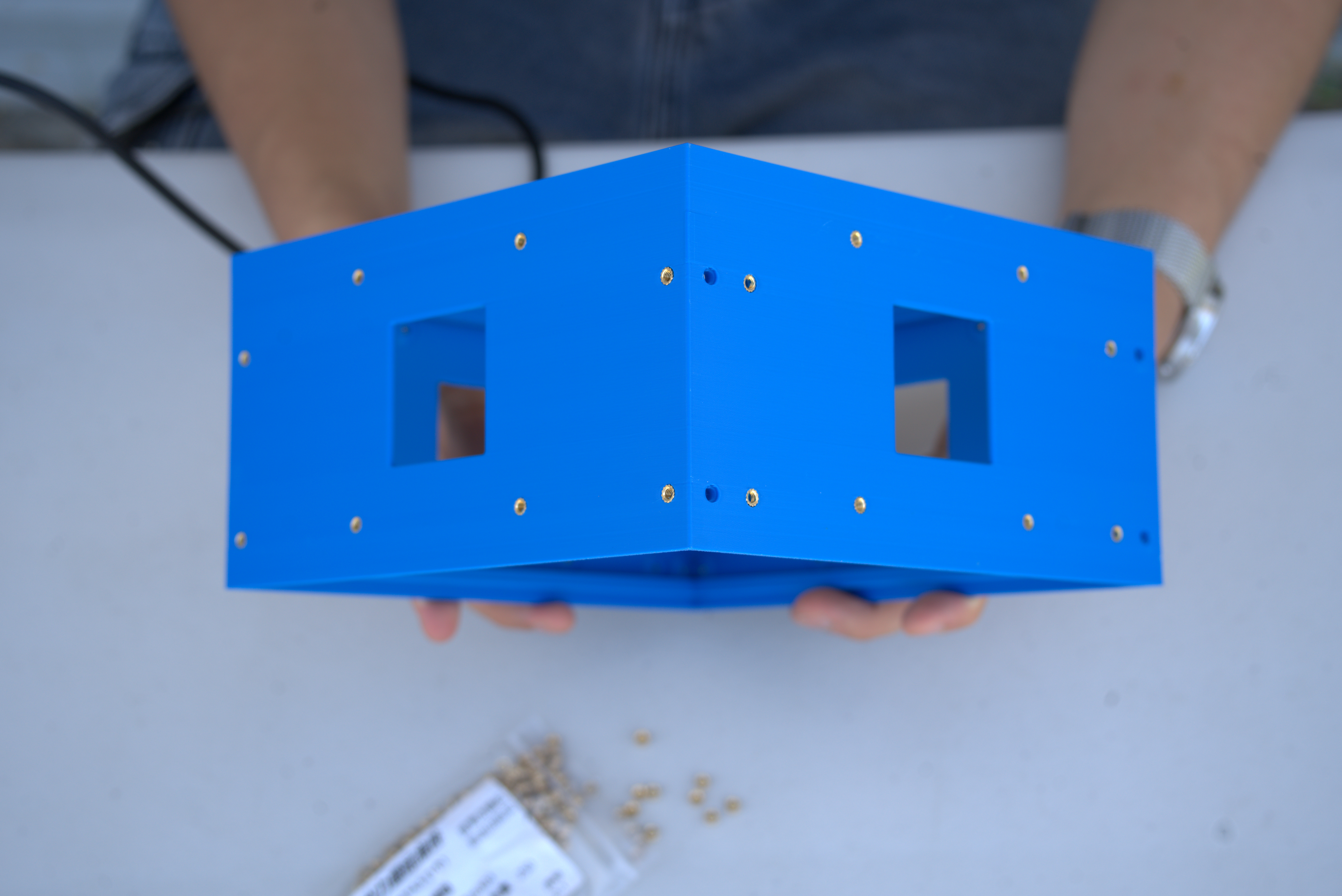 Center chassis with side heat-set inserts installed