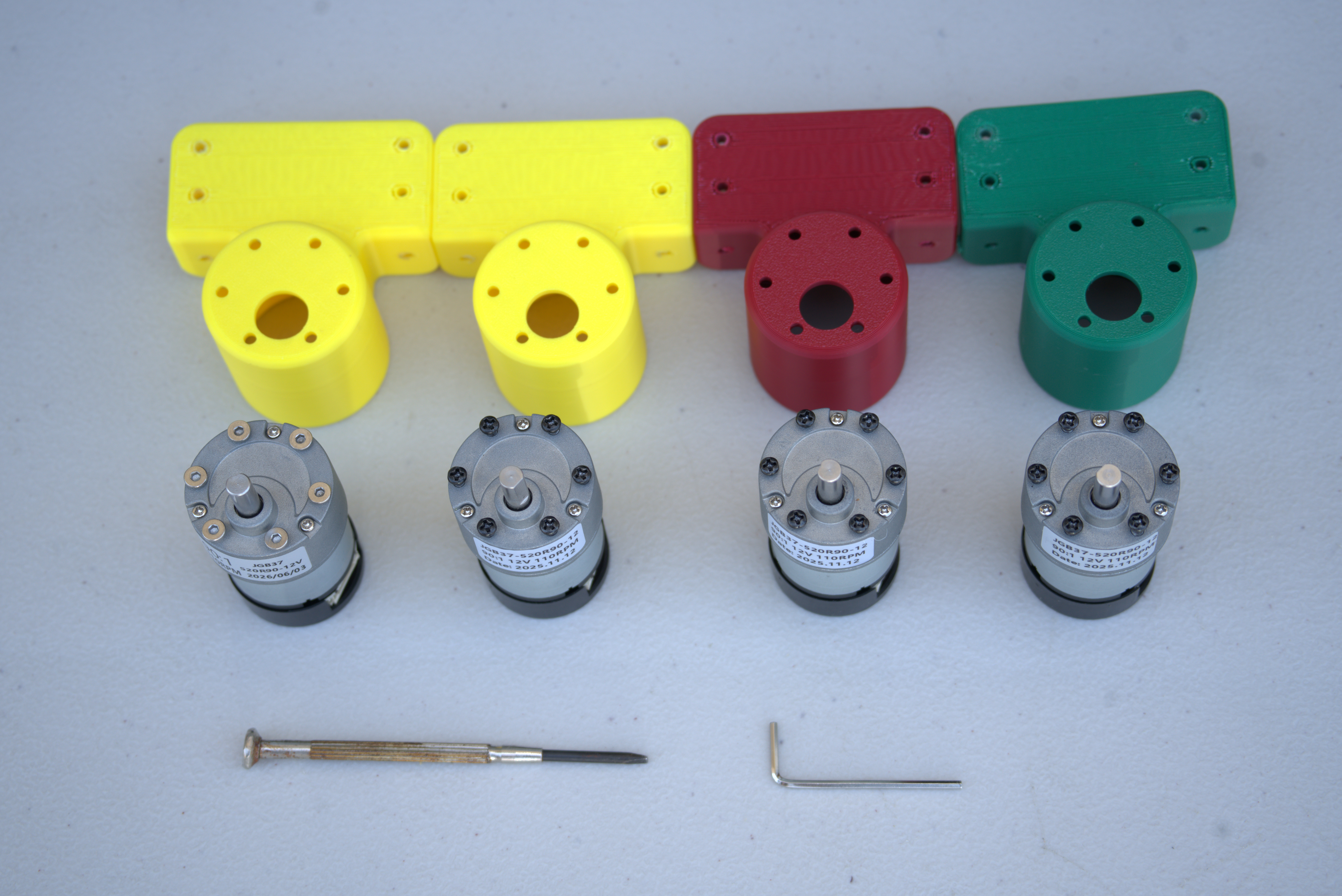 Motors, mounts, and screws before assembly